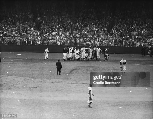 Dejected relief hurler, Dodgers' Ralph Branca , walks quietly off the mound after serving a home-run ball to Giant Bobby Thomson in the 9th frame of...