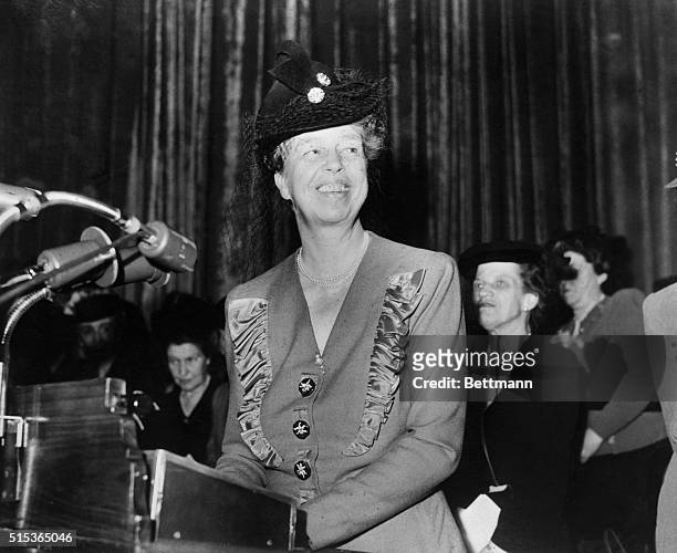 Mrs. Eleanor Roosevelt, America's first lady, is shown as she addressed the sudience at the hotel Waldorf Astoria today, opening day of the Twelth...