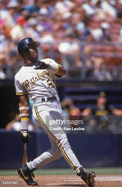 Barry Bonds of the Pittsburgh Pirates watches the flight of his hit against the San Diego Padres on August 30, 1992 at Jack Murphy Stadium in San...