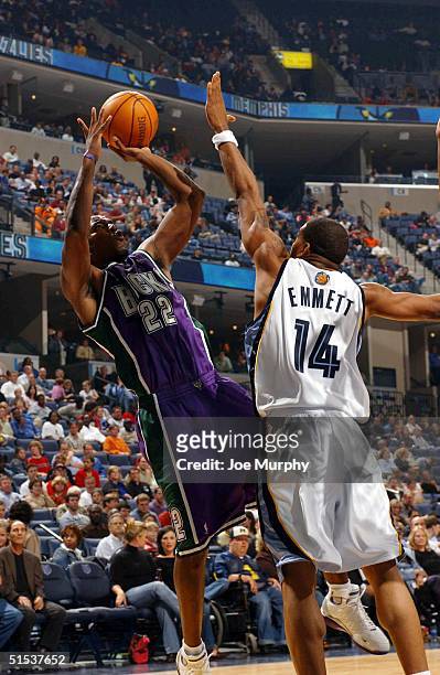 Michael Redd of the Milwaukee Bucks shoots a fade-away jumper over Andre Emmett of the Memphis Grizzlies during a game at Fedex Forum on October 21,...