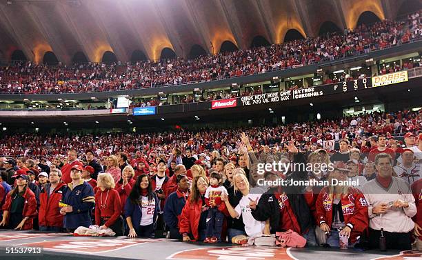 St. Louis Cardinals fans celebrate after defeating the Houston Astros in game seven of National League Championship Series during the 2004 Major...