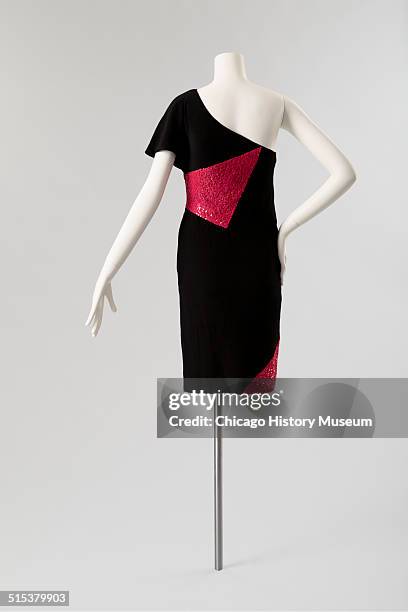 One-shouldered cocktail dress, designed by Karl Lagerfeld for Chloe, with red sequined triangular insets, 1982. Shown as part of the Chicago History...