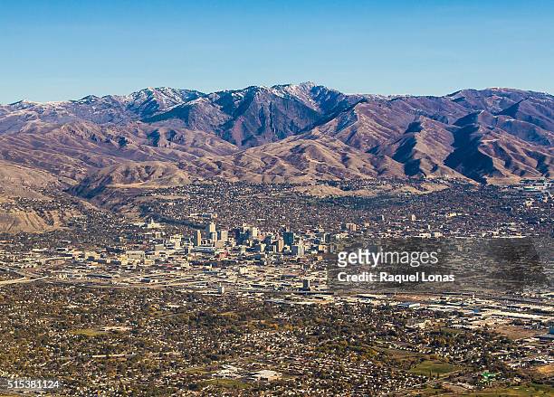salt lake city against the wasatch mountains - salt lake city stock pictures, royalty-free photos & images