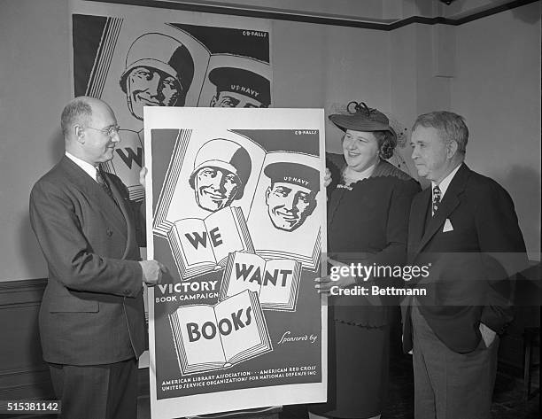 Kate Smith, radio songstress, as she presented poster, Jan. 2, advertising the Victory book Campaign, to collect all kinds of books for men in the...