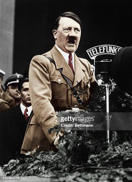 Adolf Hitler,closeup shot of the Chancellor speaking over the radio microphone.
