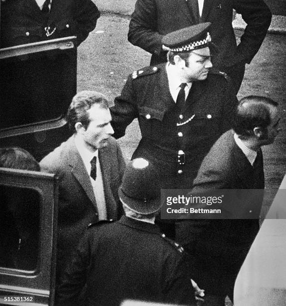 Under heavy security precautions, Ian Ball is led in handcuffs from police van to court 3/21, where he was charged with the attempted murder of...