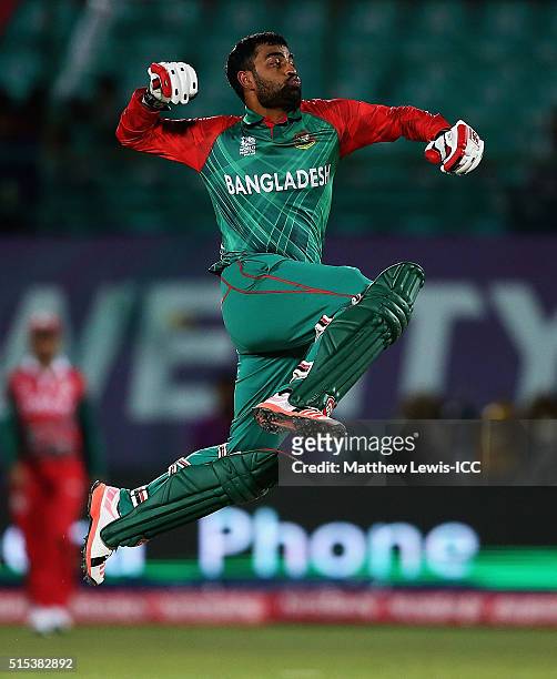 Tamim Iqbal of Bangladesh celebrates his century during the ICC World Twenty20 India 2016 match between Bangladesh and Oman at the HPCA Stadium on...
