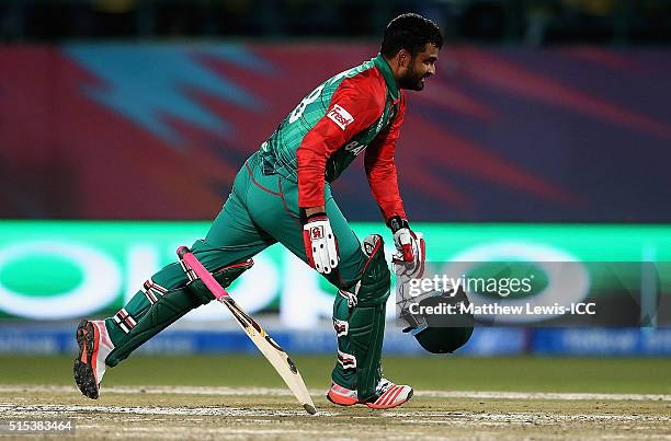 Tamim Iqbal of Bangladesh celebrates his century during the ICC World Twenty20 India 2016 match between Bangladesh and Oman at the HPCA Stadium on...