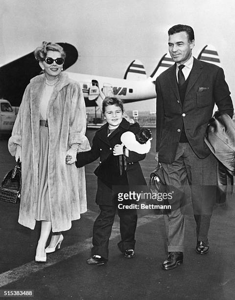 Zsa Zsa Gabor and her 7-year-old daughter, Francesca Hilton, are shown at Idlewild Airport as they flew in from Los Angeles with Dominican playboy...