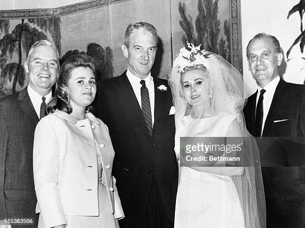Actress Zsa Zsa Gabor and her new husband, Joshua S. Cosden , pose with the wedding party following their marriage. --With the couple were J.K. Malo...