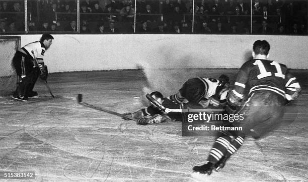 Players of the Toronto Maple Leafs and the Boston Bruins piled up in front of the Bruins' goal during a fast bit of action in the Stanley Cup game...