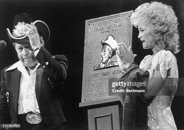 Little Jimmy Dickens tearfully steps to the microphone after he was inducted into the Country Music Hall of FAme during the 1983 Country Music...