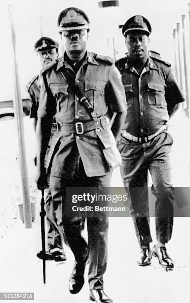 Brigadier General Murtala Rufai Mohammed, the new head of state, with Brigadier Obasanjo his Chief of Staff arriving for an inspection at the former...