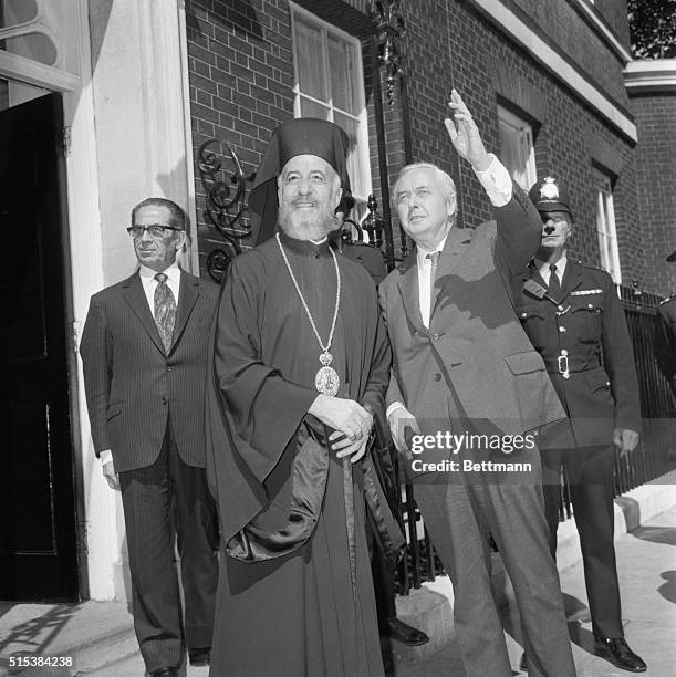 Prime Minister Harold Wilson waves to crowd as he bids farewell to Archbishop Makarios of Cyprus following meeting at 10 Downing Street 7/17.
