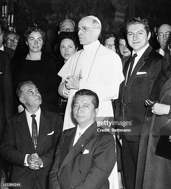 Pope Pius XII receives a group of visitors, including American pianist Liberace and his mother at the Papal summer residence here November 2nd....