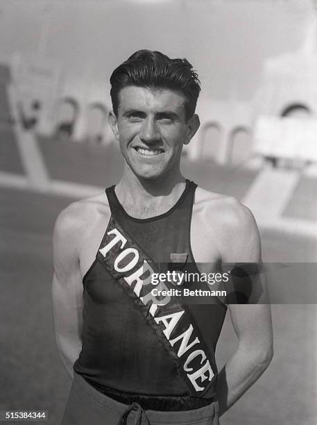 Louis Zamperini, Torrance California, hish school runner, set a new world interscholastic record of 4 minutes 21.3 seconds for the mile at the Los...