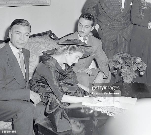 Mr. And Mrs. Porfirio Rubirosa wed on December 30, 1953. The bride is Barbara Hutton. Seated between Rubirosa and Maj. Gen. Rafael Trujillo-Martinez,...