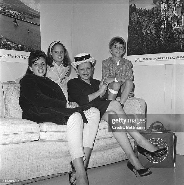 Judy Garland, takes her children to London here. Left to right are: Liza Minnelli, , Judy Garland Luft, Lorna Luft , and Joey Luft . They are shown...