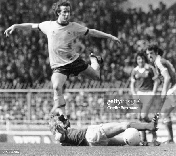 Arsenal's Liam Brady flies over Ipswich Town's David Geddis after ball during play here. Arsenal was leading 1-0.