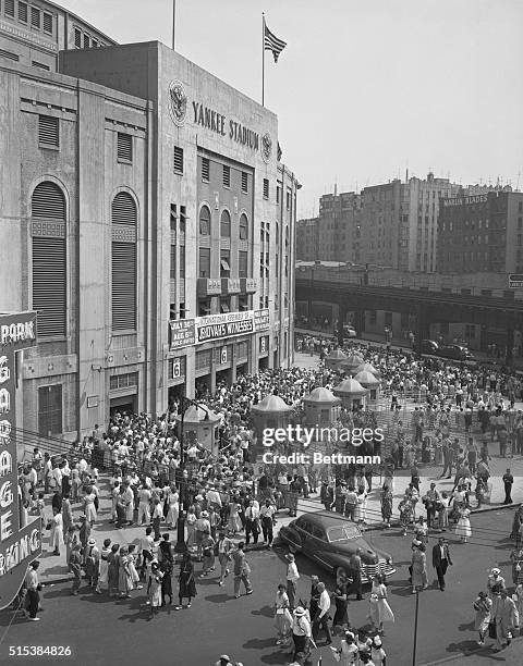 New York: Jehovah's Witnesses Convention. Yankee Stadium. Wide angle views made as the members of the sect line up for noon meal at the tent city...