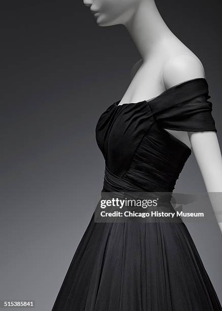 Black chiffon cocktail dress, designed by James Galanos and distributed by Blum's Vogue, Chicago, Illinois, 1958. Shown as part of the Chicago...