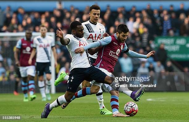 Carles Gil of Aston Villa battles with Danny Rose of Tottenham Hotspur during the Barclays Premier League match between Aston Villa and Tottenham...