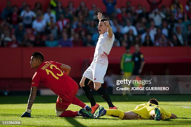 Sevilla's French forward Kevin Gameiro celebrates past Villareal's French goalkeeper Alphonse Areola after scoring during the Spanish league football...