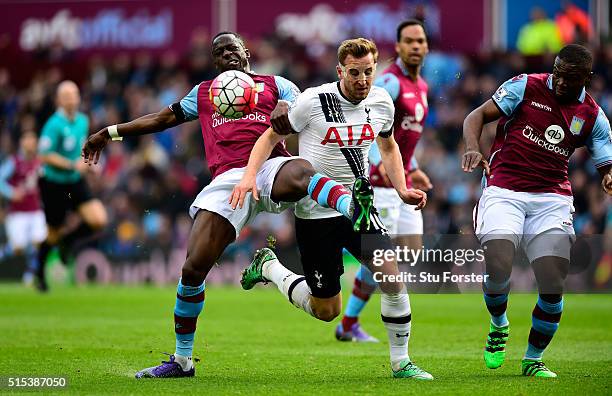 Harry Kane of Tottenham Hotspur battles with Aly Cissokho of Aston Villa during the Barclays Premier League match between Aston Villa and Tottenham...