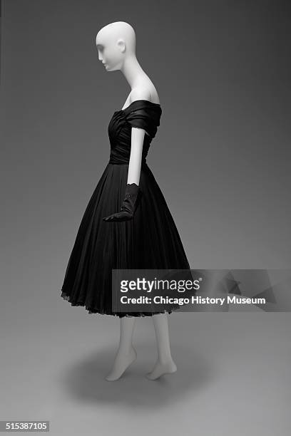 Black chiffon cocktail dress, designed by James Galanos and distributed by Blum's Vogue, Chicago, Illinois, 1958. Shown as part of the Chicago...