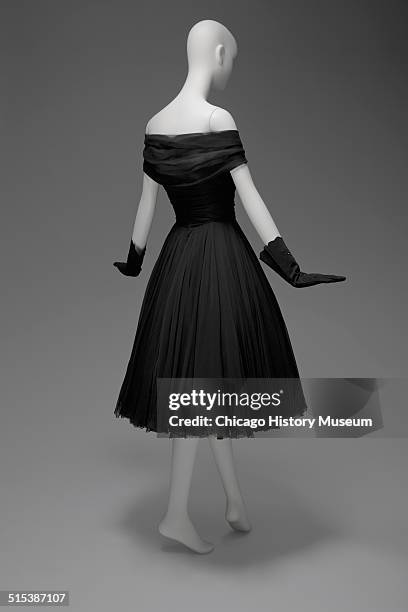 Black chiffon cocktail dress, designed by James Galanos and distributed by Blum's Vogue, Chicago, Illinois, 1958. Shown as part of the Chicago...