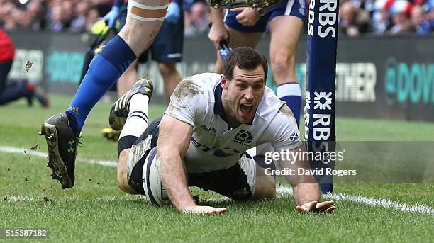 Tim Visser of Scotland dives over in the corner, for a second half try during the RBS Six Nations match between Scotland and France at Murrayfield...