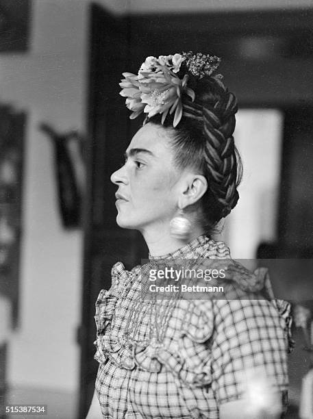 Frida Kahlo, , Mexican painter and wife of Diego Rivera is shown in this head and shoulders photograph.