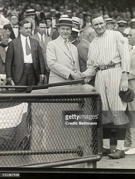 Washington, DC: President Calvin Coolidge presents Walter Johnson with 1924 American League Diploma. Photo by Herbert E. French.