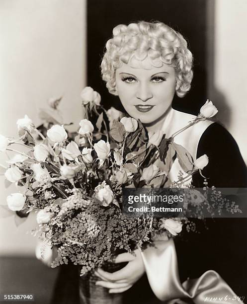 It's Mae Day, and Mae West celebrates with Mae flowers on May 1st. The blonde Mae is offering the nation a "Mae Day" present for her latest Paramount...