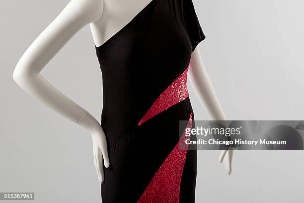 One-shouldered cocktail dress, designed by Karl Lagerfeld for Chloe, with red sequined triangular insets, 1982. Shown as part of the Chicago History...