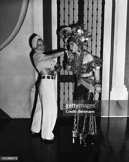 That's Carmen Miranda and "Carmen Mirooney". If you can take the hint from the latter name, you'll guess who that is on the right. It's none other...
