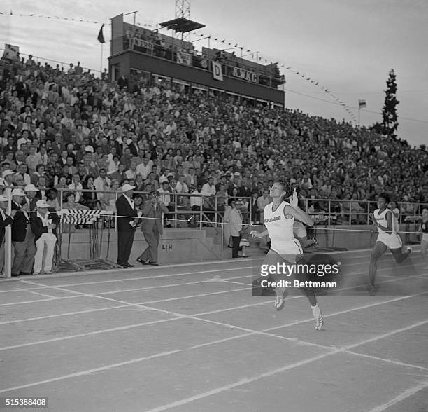 Wilma Rudolph wins the 100 meter run at the California Relays. She edged out Vivian Brown and Jackie Mack.