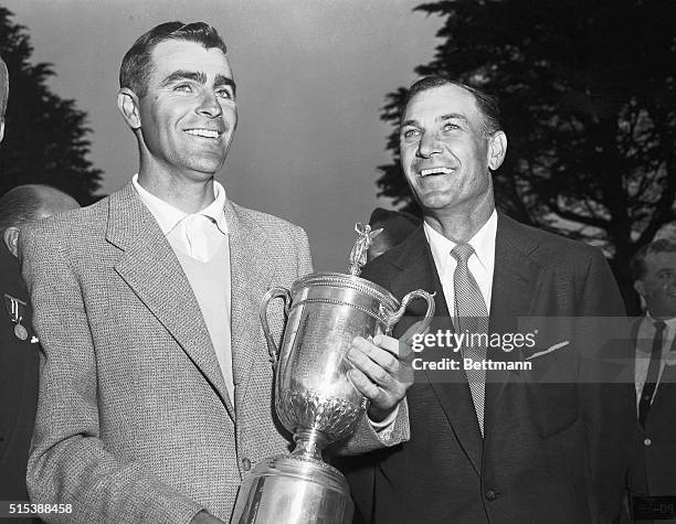 Jack Fleck, 32-year-old pro from Davenport, IA, looks mighty pleased as he holds the gleaming trophy after winning the National Open Golf by beating...