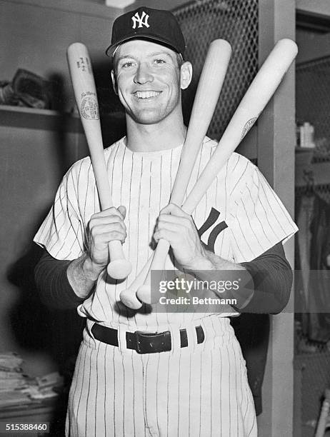 Here's Yankee slugger Mickey Mantle toting lumber in both hands after literally hitting roundtrippers left and right. He drove in all the Yankee runs...