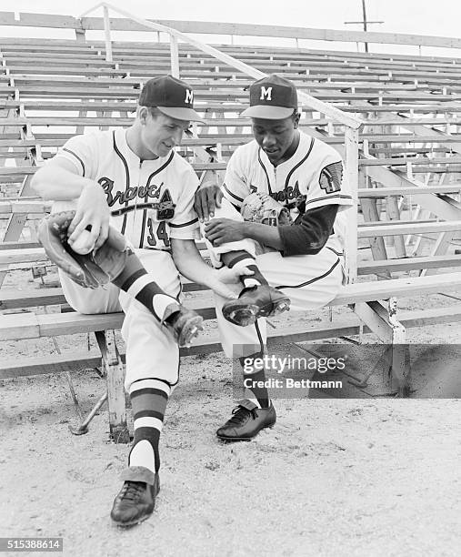 Bobby Thomson shows where he broke his ankle to Hank Aaron who also broke his last year.