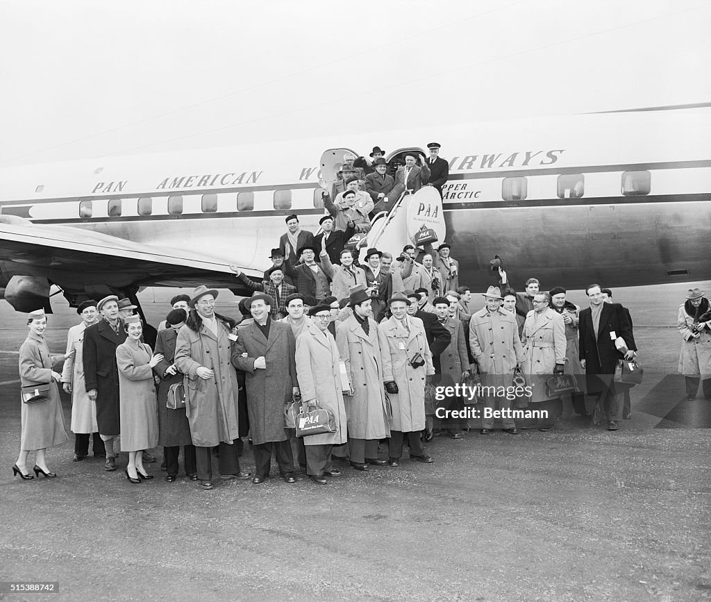 People Disembarking from Airplane