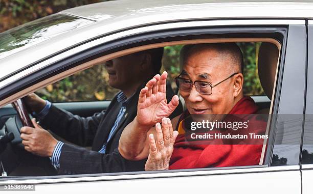 Tibetan spiritual leader Dalai Lama giving waving towards Buddhist Nuns at Dharamsala, as he arrived from Minnesota, USA after 50 days, on March 13,...