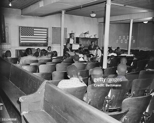 View of a racially segregated classroom. The Federal Government, in an unprecedented move, asked the courts yesterday to force Prince Edward County,...