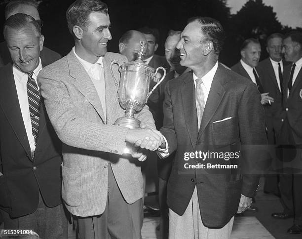 Left to right: John Fleck and Ben Hogan are shown shaking hands after Fleck, a virtual unknown, won the National Open golf tournament in San...