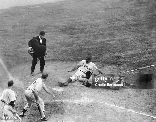 Philadelphia: Giants-Phillies baseball-First of two games-Willie Jones, Phillies third baseman is out at the plate in sixth inning when he tried to...