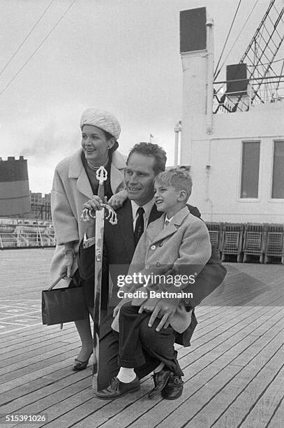 New York, NY- Actor Charleton Heston and his wife Lydia and their son Fraser arrive here May 2nd, on the liner Queen Mary. The Hestons arrived here...