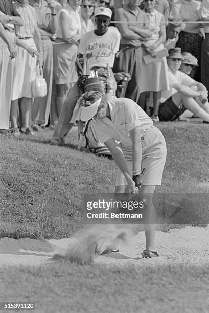 Mickey Wright, of Dallas, TX, shows she used to win the US Women's Open Golf Championship at the Baltusrol golf club here. The 26-year-old blonde is...