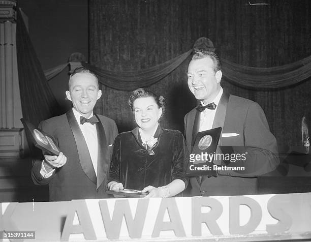 Bing and Judy Get Look Mag Awards. Hollywood, California: Bing Crosby and Judy Garland look mighty happy after receiving Look Magazine best actor and...