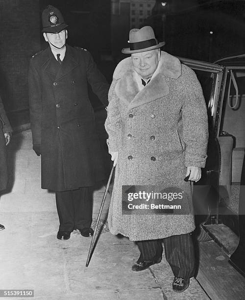 Back from his home in Chequers after the weekend, Prime Minister Sir Winston Churchill is shown arriving at No. 10 Downing Street in a fur-lined coat...