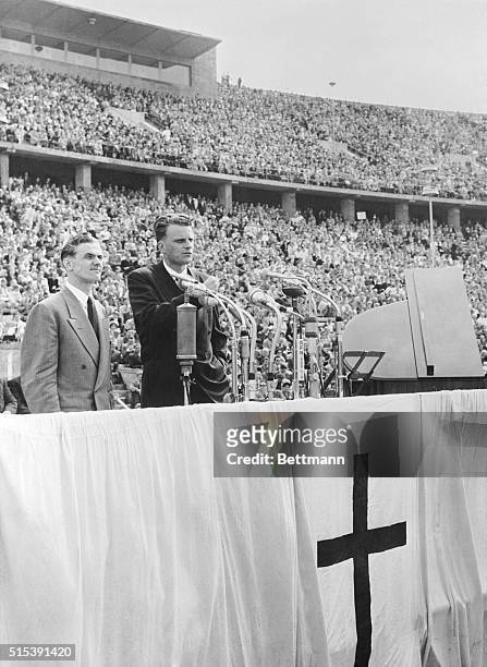 June 30, 1954-Berlin, Germany: Berlin crowds hear evangelist Billy Graham. More than one hundred thousand persons packed Olympic Stadium in the...